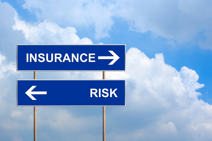 Insurance and risk on blue road sign with blue sky