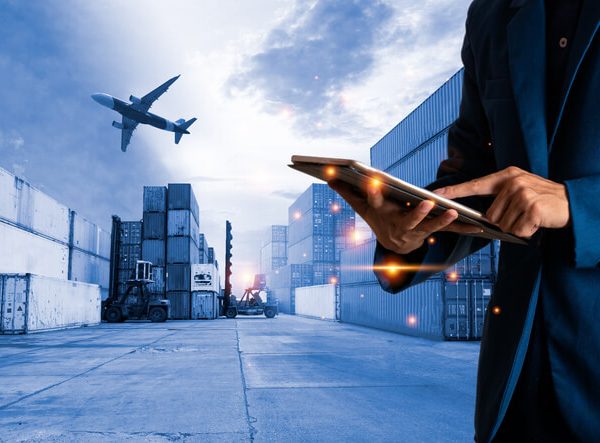 A load planner holding a tablet in a warehouse after dispatch training