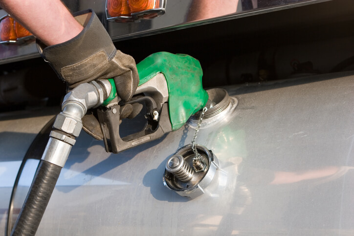 A mechanic fuelling up a freight transport in diesel mechanic training