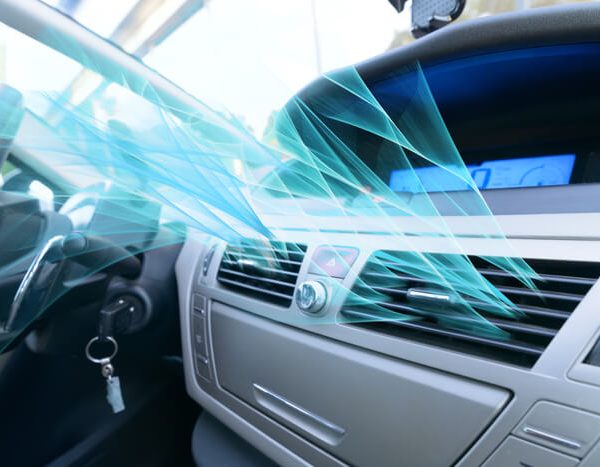 A technician testing the cooling system after automotive air conditioning training