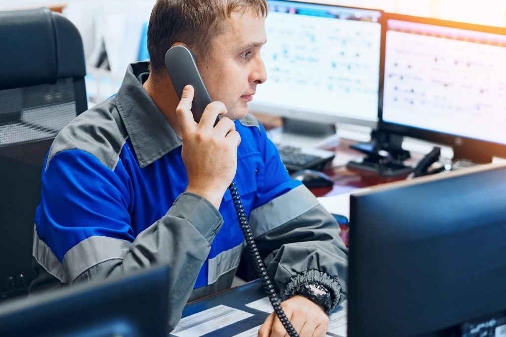 A male taxi dispatcher at work after automotive training