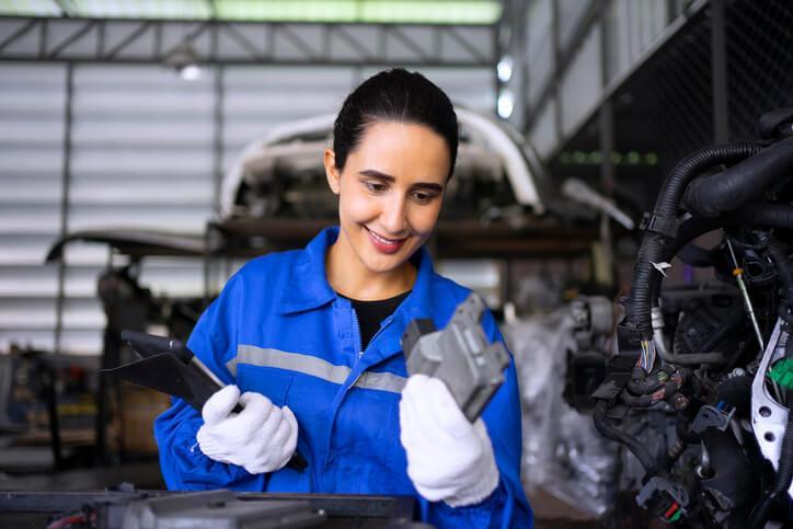 An auto parts training grad organizing parts